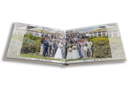 Bride and groom and all guests outside Kilworth House captured by Leicestershire wedding photographer John Fox