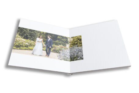 The bride and groom to be on their Pre-wedding shoot at Ragley Hall in Warwickshire. Guest book created by John Fox Wedding Photography.