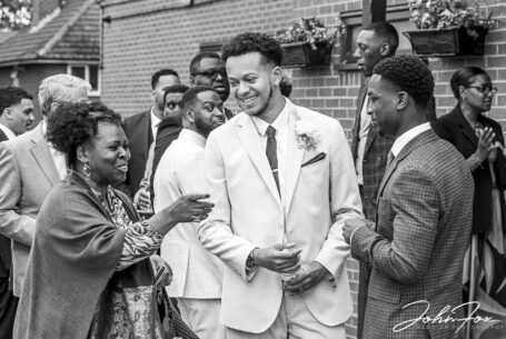 Kai, the Groom, with guests at his West Midlands' wedding.