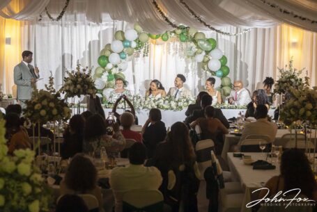 Bride and groom, Zoe and Kai at the top table during the wedding speeches