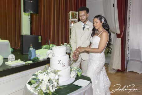 Bride and groom, Zoe and Kai, cutting the cake at Fentham Hall.