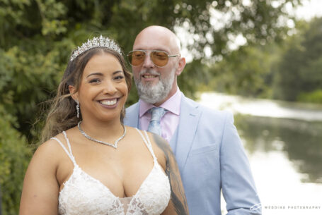 Bride and groom by the Great River Ouse on their wedding day