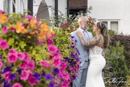 Hazel and Chris outside the Kingfisher Hotel in Bedfordshire on their wedding day. Photo by John Fox