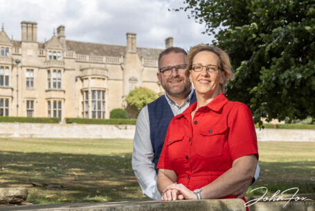 Bride and groom, Joanne and Kevin, on a pre-wedding shoot with Rushton Hall in the background.