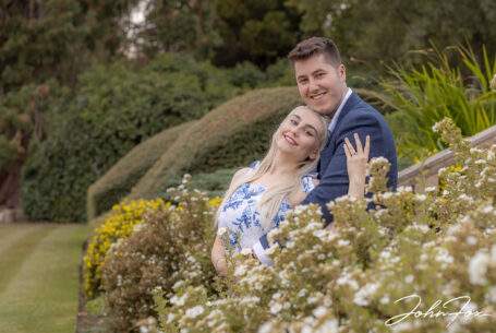 Couple on a pre-wedding shoot in the gardens at Kilworth House by wedding photographer John Fox