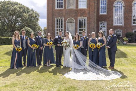Bridal party in the grounds at Chicheley Hall in Buckinghamshire. Photo by John Fox Wedding Photography.