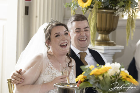 Wedding Speeches and bride and groom's reactions. Photo by John Fox Wedding Photography.