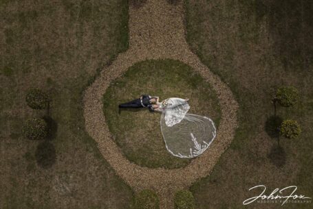Bride and groom from above. Image taken using a drone in the grounds at Chicheley Hall in Buckinghamshire.