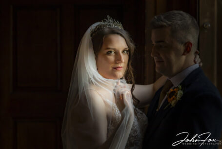Bride and groom portrait using natural light at Chicheley Hall in Buckinghamshire
