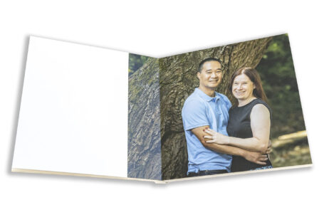 An image from Rebecca and Son's guest book of them in the grounds at Hadley Park House in Telford, Shropshire during their pre-wedding shoot by John Fox