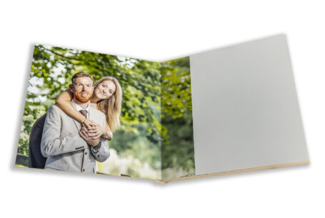 Tanya & Shane's Wedding Guest Book with Pre-wedding shoot images for their wedding at Holmewood Hall in Cambridgeshire. Image of the couple at Fawsley Estate in Northamptonshire.