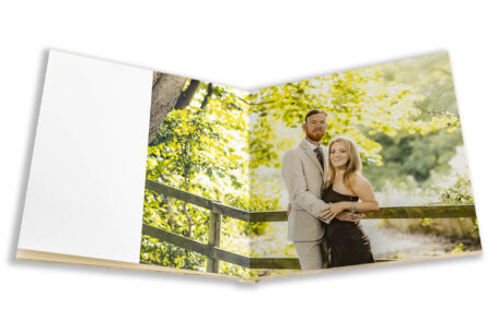 Wedding guest book featuring images from a pre-wedding shoot at Fawsley Estate in Northamptonshire. Tanya and Shane's wedding will take place at Holmewood Hall in Cambridgeshire