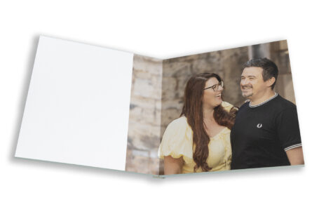Amy and Karl’s Guest Book by John Fox Wedding Photography. Leicester Wedding Photographer capturing the couple laughing together.