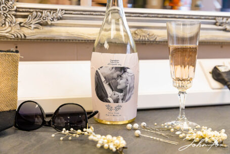 Jewellery and a glass of bubbly before Emma's Kilworth House Wedding
