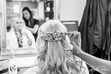 Bride having her hair prepared for her wedding at Kilworth House