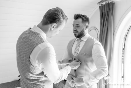 William, the groom, and his groomsmen getting ready at Kingscote Barn in Tetbury