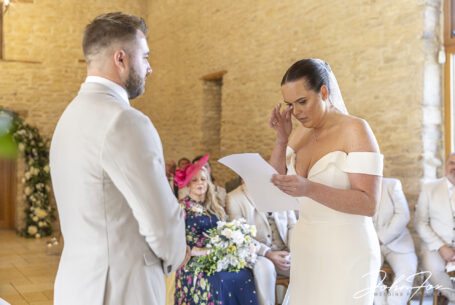 Gabrielle shedding a tear while reading her speech to William at their Gloucestershire wedding.