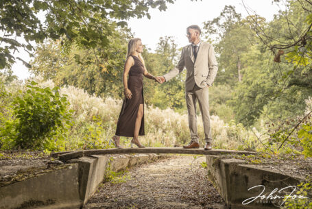 Tanya and Shane’s Pre-Wedding Photographs. An image of them on a bridge at Fawsley Estate in Northamptonshire.
