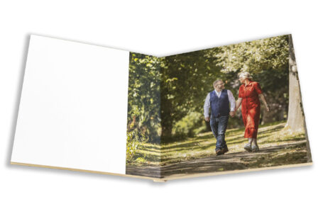 Joanne and Kevin in the grounds at Rushton Hall in Northamptonshire for their pre-wedding shoot. Image is part of the Personalised Guest Book by John Fox Wedding Photography.