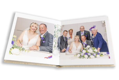 Samantha and Paul signing the register at their Staffordshire Wedding. Image by John Fox Wedding Photography