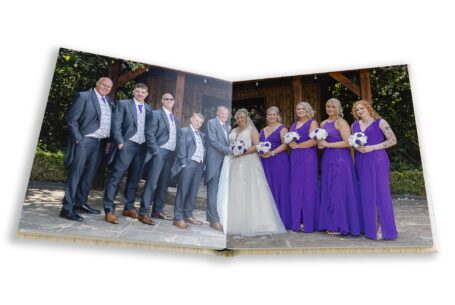 Staffordshire Wedding. Wedding album image showing the newly-weds with bridesmaids and groomsmen by John Fox Wedding Photography