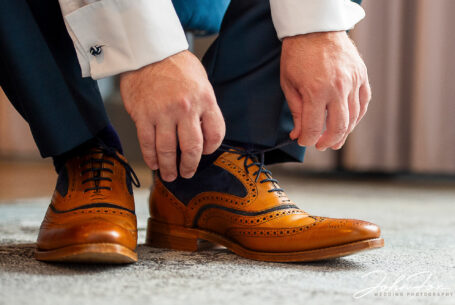 Karl the Groom getting into his Wedding shoes