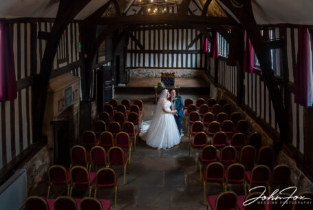 Bride and groom at The Leicester Guildhall. A moment together on their own in the great hall.