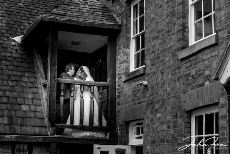 Amy and Karl on a balcony at The Leicester Guildhall.