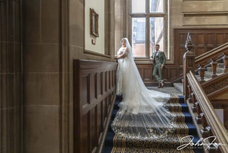 Keele Hall’s indoor spaces provided stunning settings for portraits. Sarah and Lewis on the grand staircase by John Fox.