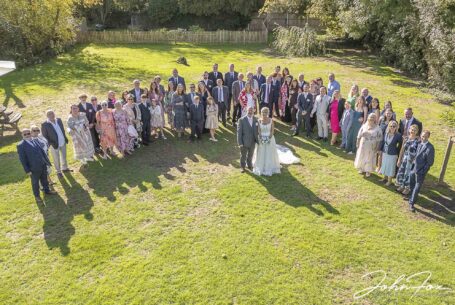 All wedding guests in a group. Image taken with a drone by John Fox, wedding photographer in Bedfordshire