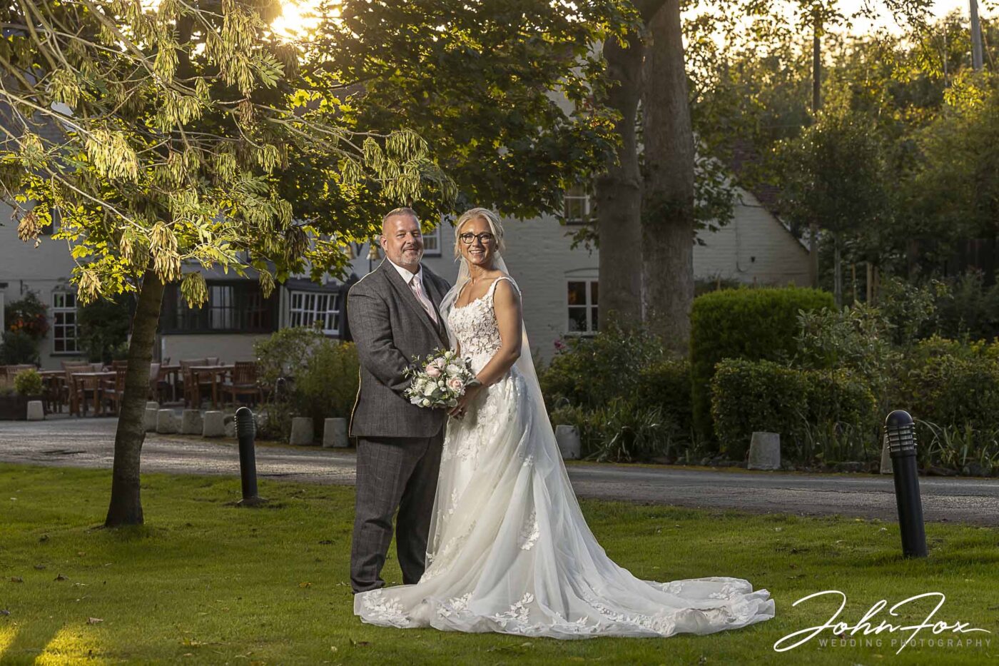 Wedding photographer in Bedfordshire. Lynn and Ian’s wedding at The Five Bells in Stanbridge. The happy couple outside the charming pub.