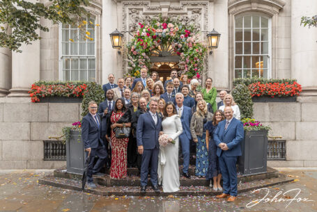 Wedding guests on the famous steps at Chelsea Registry Office. Photo by John Fox Wedding Photography