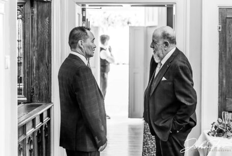 The Groom and bride's father awaiting the bride for the Hadley Park House wedding ceremony. Image by John Fox Wedding Photography.