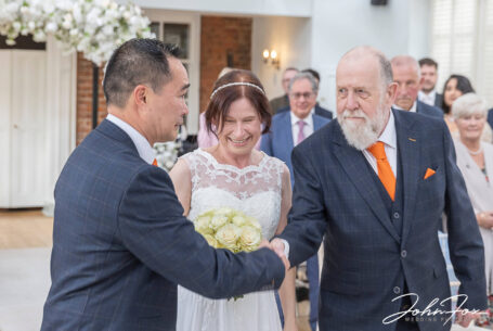 Rebecca the bride being given away by her father. Hadley Park House Wedding Photography