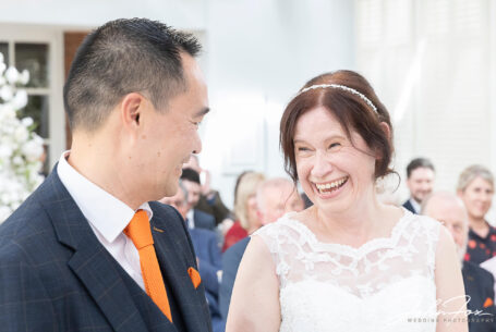The happy bride and groom during the wedding ceremony at Hadley Park House, Telford, Shropshire.