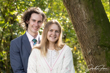 Pre-wedding shoot image of the happy couple in woodland at Hothorpe Hall
