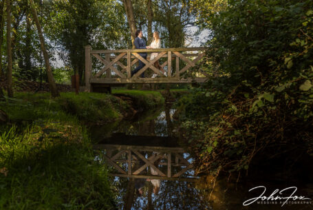 Sophie and Jack on a bridge at Hothorpe Hall The Woodlands