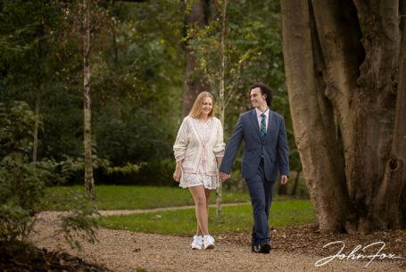 Pre-wedding shoot image of the happy couple in woodland at Hothorpe Hall