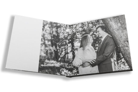 Sophie and Jack leaning against a tree. Hothorpe Hall The Woodlands' image for their pre-wedding shoot by John Fox.