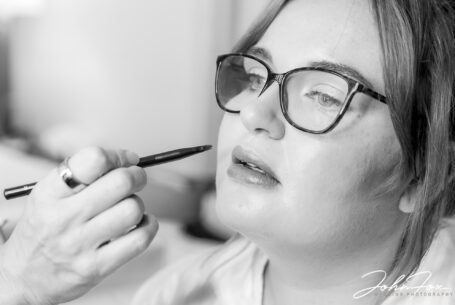 Bridal preparations: Close up image of Katie having her makeup applied. Experienced Milton Keynes Wedding Photographer near you.