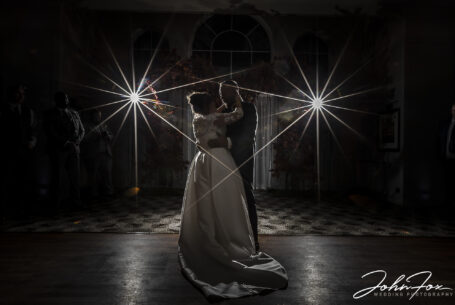Spotlit image by John Fox as Katie and Matthew take to the floor for their First Dance at their Milton Keynes Wedding
