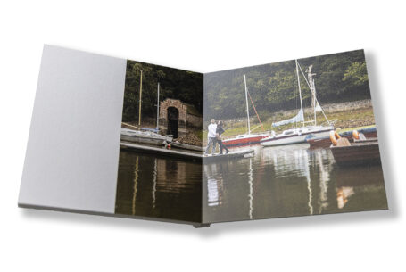 Bespoke wedding guest book with image of the happy couple on a pre-wedding shoot at Rudyard Lake in Staffordshire
