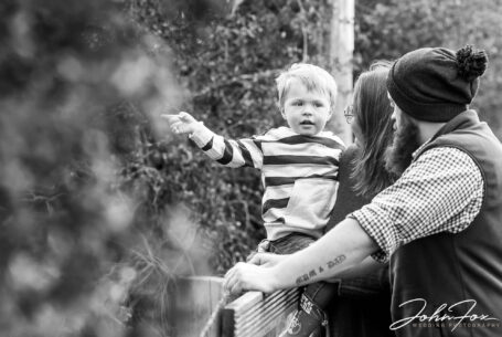 The wedded couple to be with their son pointing something out in one of their fields in Northamptonshire.