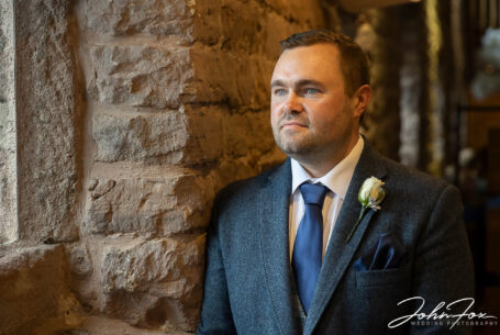 Groom waiting for his bride at The Ashes Barns in Staffordshire