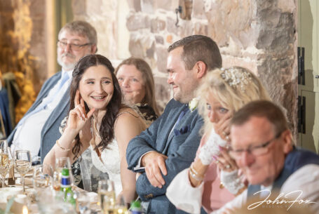 Wedding speech reactions. Family and guests enjoying themselves at The Ashes Barns in Staffordshire