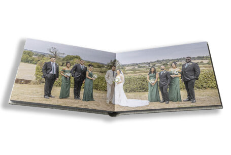 Wedding album showing the formal group including the bride and groom, Zoe and Kai. Photo by John Fox Wedding Photography