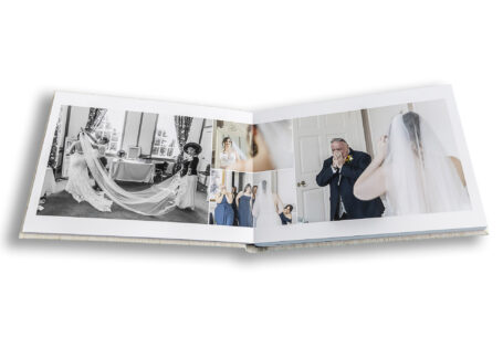 Wedding album showing images from a wedding at Chicheley Hall, Buckinghamshire. Father's reaction to his daughter in her wedding dress.