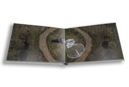 Drone photo at the Buckinghamshire Wedding of Grace and Elliott at Chicheley Hall. Aerial image of the newly-weds.