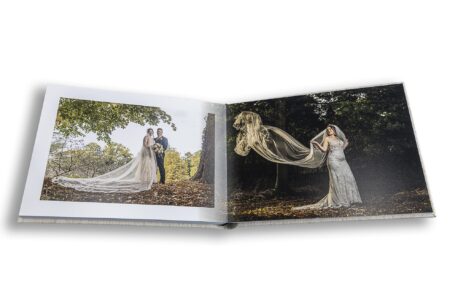 Grace's veil fluttering behind her in the breeze while she walks through the grounds at Chicheley Hall. Buckinghamshire