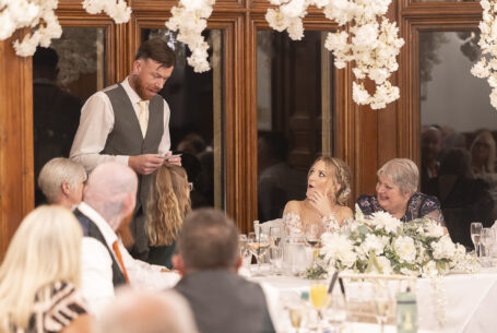 The groom's speech with a shocked look on the bride's face. Cambridgeshire wedding photography
